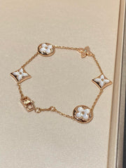 STAR AND SUN 5 MOTIF MOP PINK GOLD BRACELET