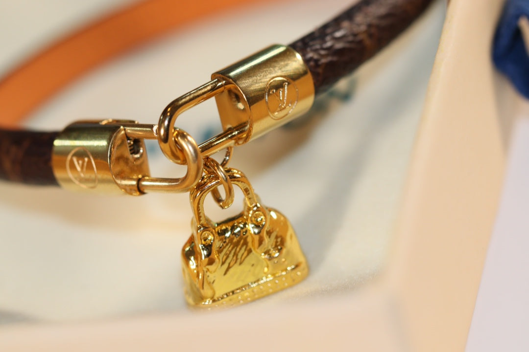 LV ALMA PINK GOLD CANVAS