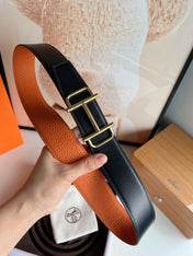 HM ROYAL BELT BUCKLE & REVERSIBLE NOIR AND ORANGE LEATHER STRAP 32 MM GOLD HARDWARE