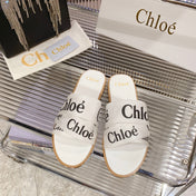 WOODY SLIPPER IN WHITE MIX BLACK CANVAS