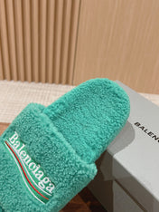 FURRY SLIDES IN TURQUOISE CURLY SHEARLING