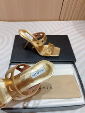 ALAIA TWO-STRAPS HIGH HEEL SANDALS IN GOLDEN PATENT LAMBSKIN