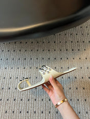 ALAIA FOLDED FLAT MULES WITH SPHERES ON WHITE CALFSKIN