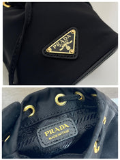 MINI BUCKET BAG 10 IN BLACK RE-NYLON AND SAFFIANO LEATHER STRAP