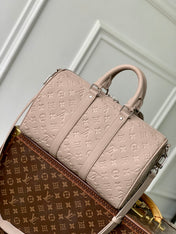 KEEPALL BANDOULIÈRE 34 BAG IN LIGHT BROWN MONOGRAM TAURILLON CALFSKIN