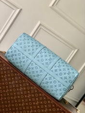 KEEPALL BANDOULIÈRE 50 IN SKY BLUE MONOGRAM SHADOW EMBOSSED CALFSKIN