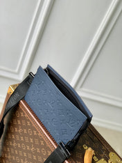 POCHETTE VOYAGE 22 IN DARK BLUE MONOGRAM SHADOW CALFSKIN