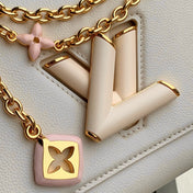 TWIST SLIM 19 IN LIGHT PINK TAURILLON CALFSKIN GOLD HARDWARE