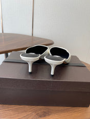 ALAIA 26S HEELED MULES 50 MM IN WHITE GLOSSY CALFSKIN