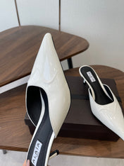 ALAIA 26S HEELED MULES 50 MM IN WHITE GLOSSY CALFSKIN