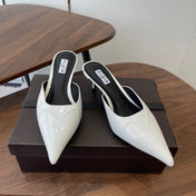 ALAIA 26S HEELED MULES 50 MM IN WHITE GLOSSY CALFSKIN