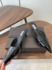 ALAIA 26S HEELED MULES 50 MM IN BLACK GLOSSY CALFSKIN