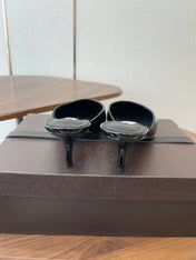 ALAIA 26S HEELED MULES 50 MM IN BLACK GLOSSY CALFSKIN