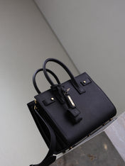 YSL 25S SAC DE JOUR MM 26 IN BLACK SUPPLE GRAINED CALFSKIN GOLD HARDWARE
