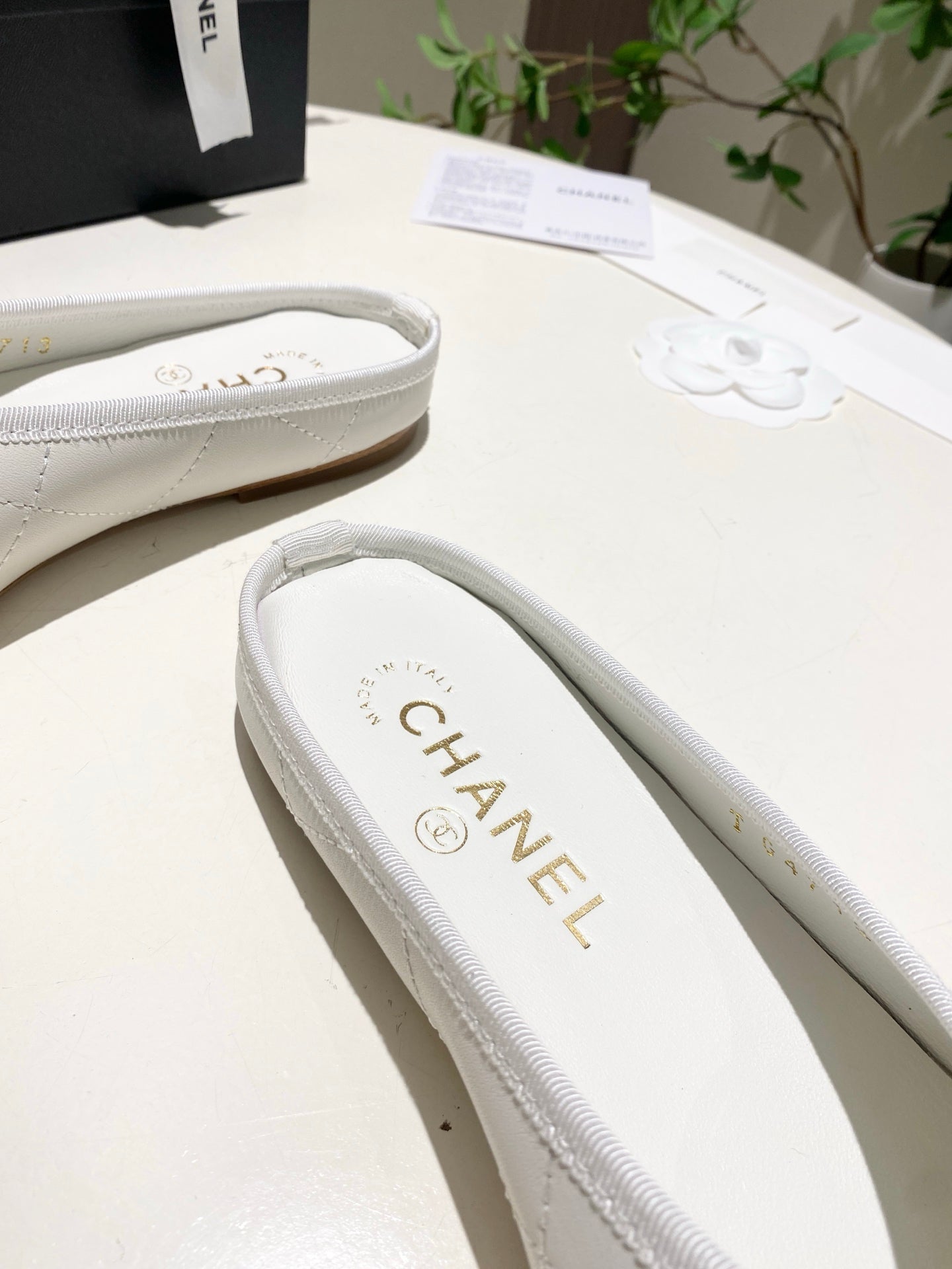 CHANEL 26S FLAT MULES IN WHITE LAMBSKIN