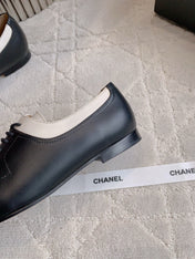 CHANEL 25S TWO TONE LACE UP IN BLACK AND WHITE CALFSKIN