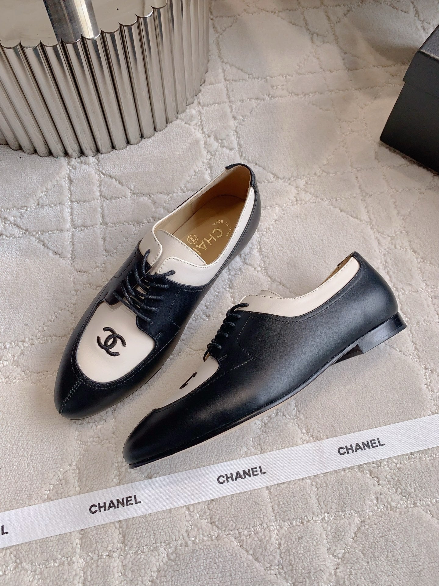 CHANEL 25S TWO TONE LACE UP IN BLACK AND WHITE CALFSKIN