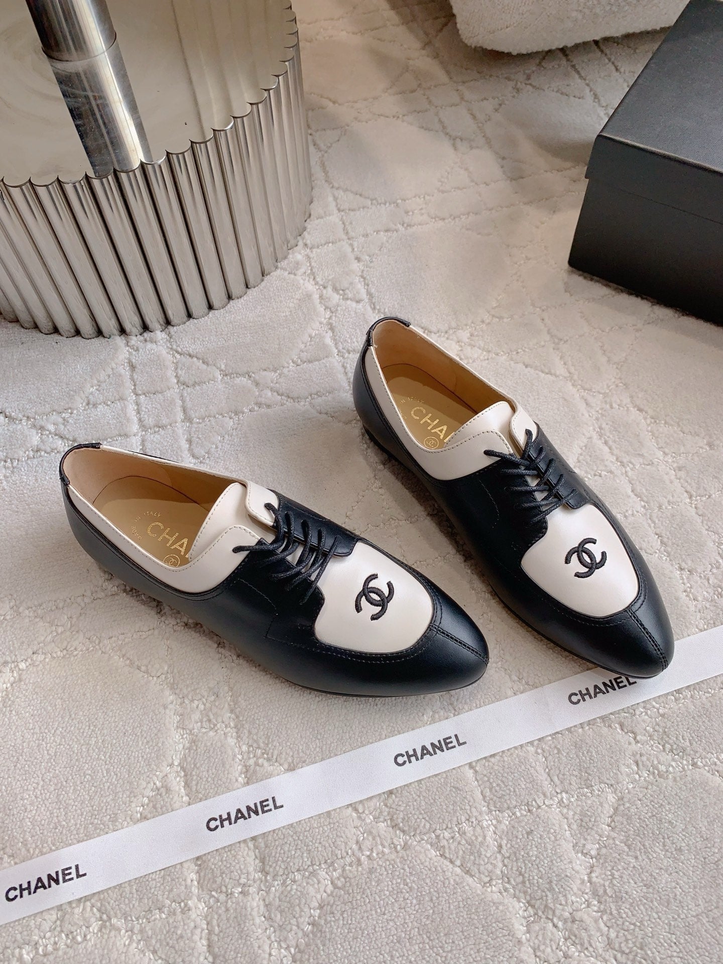 CHANEL 25S TWO TONE LACE UP IN BLACK AND WHITE CALFSKIN