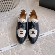 CHANEL 25S TWO TONE LACE UP IN BLACK AND WHITE CALFSKIN
