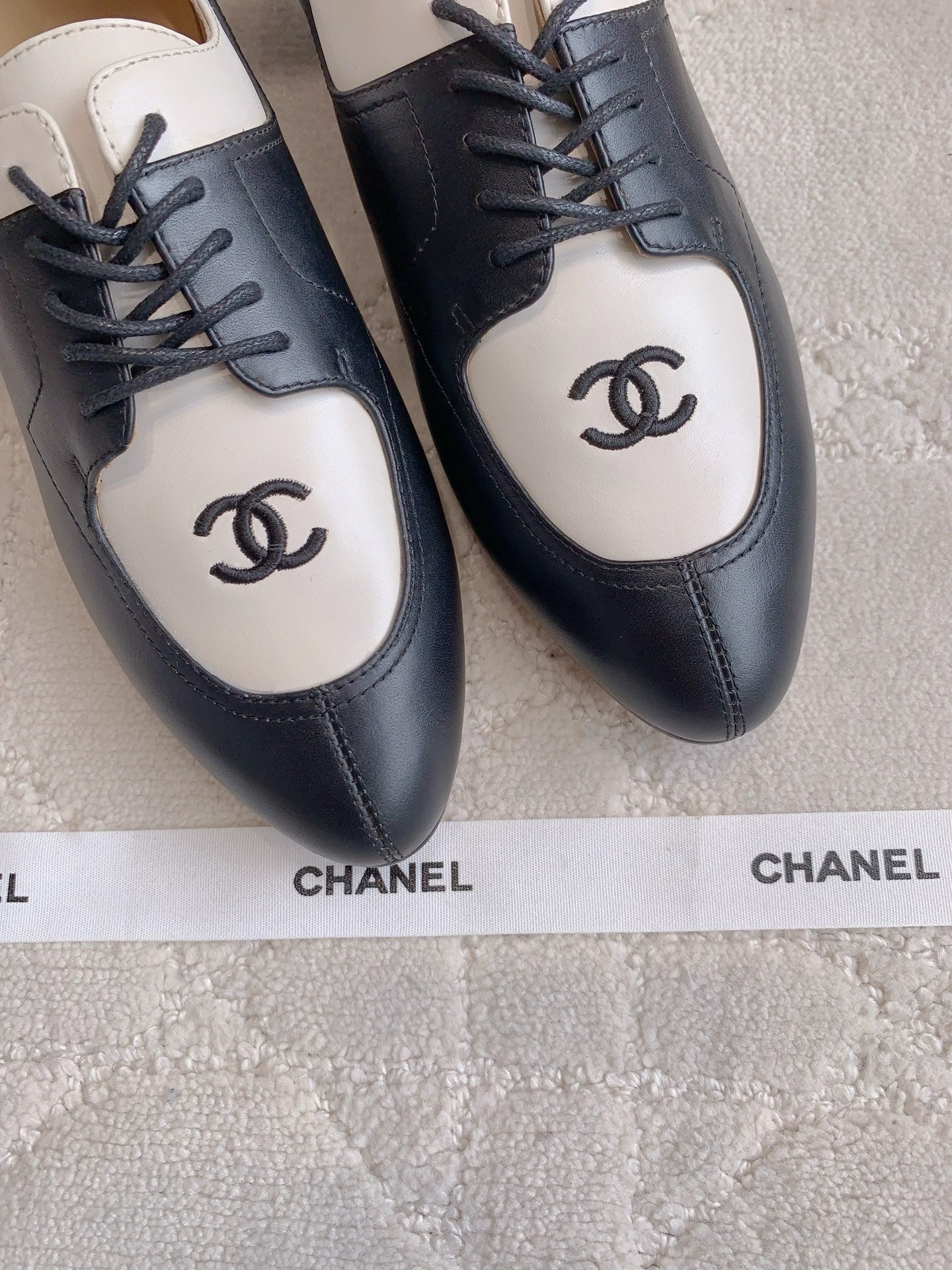 CHANEL 25S TWO TONE LACE UP IN BLACK AND WHITE CALFSKIN