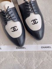 CHANEL 25S TWO TONE LACE UP IN BLACK AND WHITE CALFSKIN