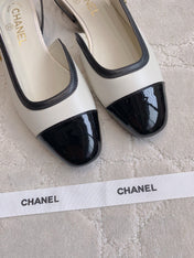 CHANEL 25S SLINGBACK IN BLACK AND WHITE CALFSKIN GOLD HARDWARE