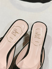 CRYSTAL HEEL MULE IN BLACK PATENT CALFSKIN WITH EMBELLISHED BUCKLE