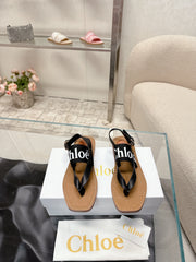 THONG SANDALS IN BLACK CALFSKIN AND CANVAS