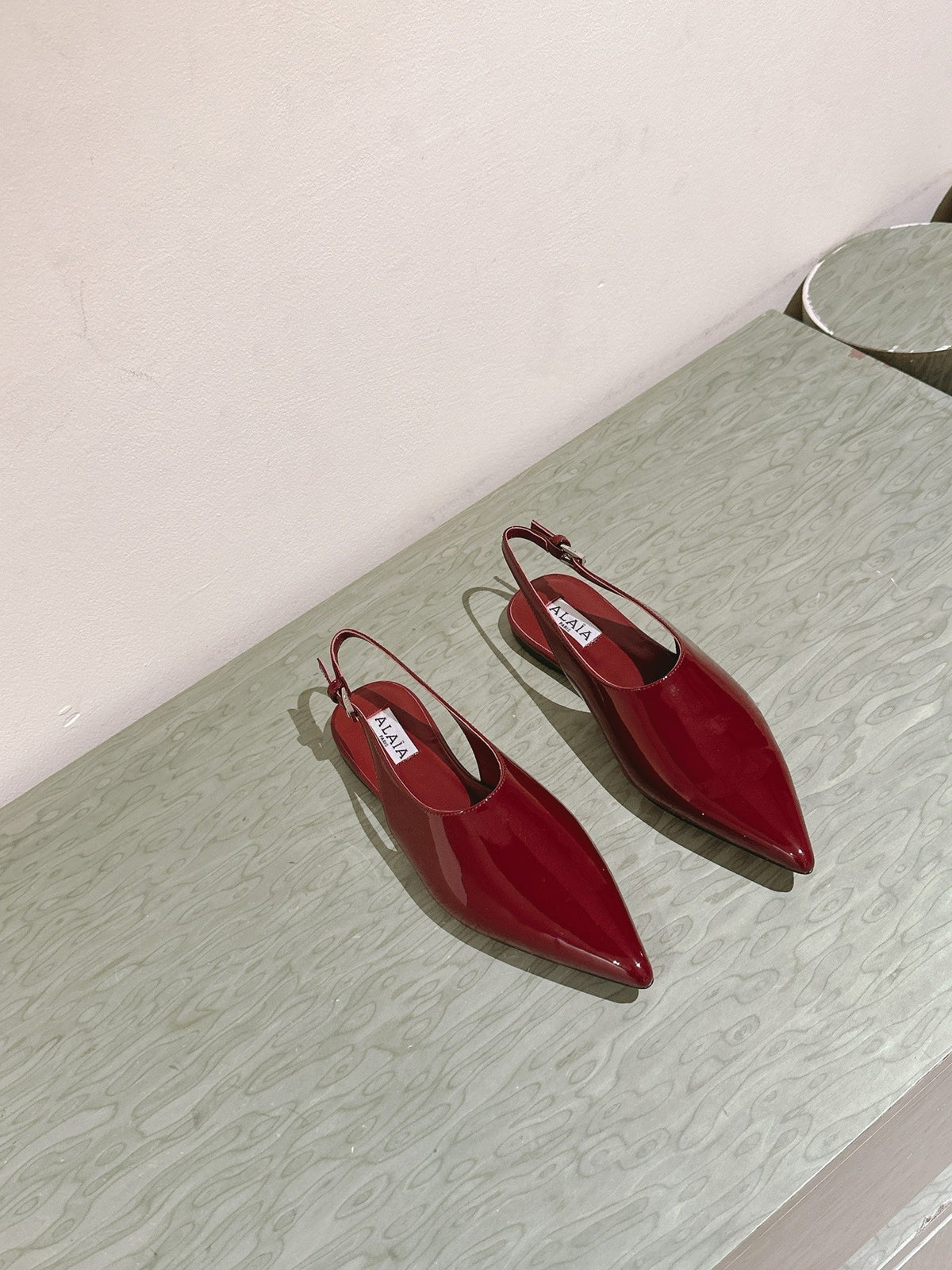 ALAIA SLINGBACK 25S IN RED PATENT LEATHER