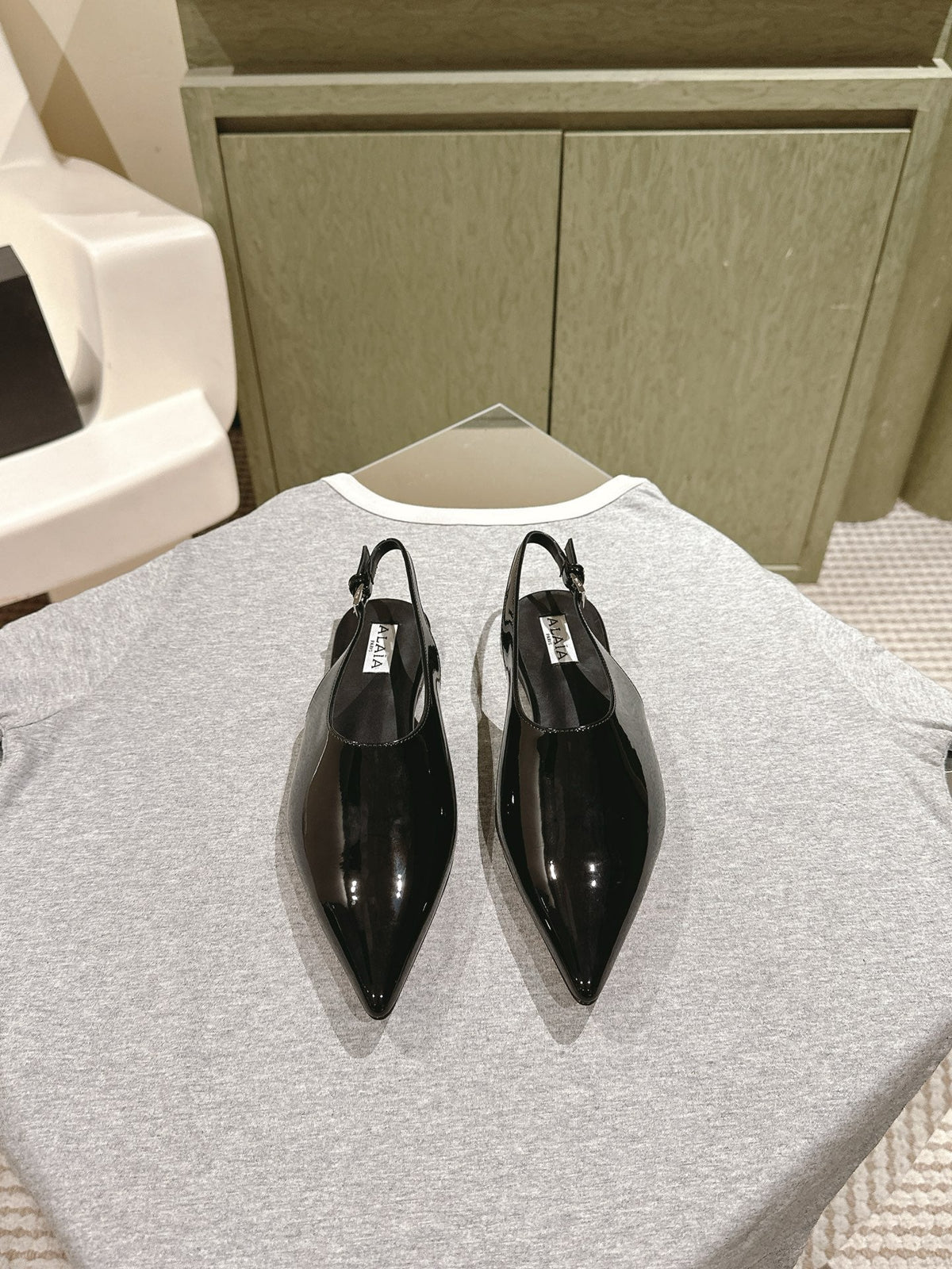 ALAIA SLINGBACK 25S IN BLACK PATENT LEATHER