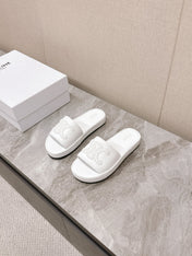 THICK-SOLED SLIDES IN WHITE SMOOTH LAMBSKIN LOGO WITH CRYSTALS