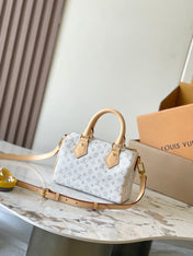 SPEEDY BANDOULIÈRE 20 IN WHITE MONOGRAM JACQUARD AND BEIGE CALFSKIN TRIM