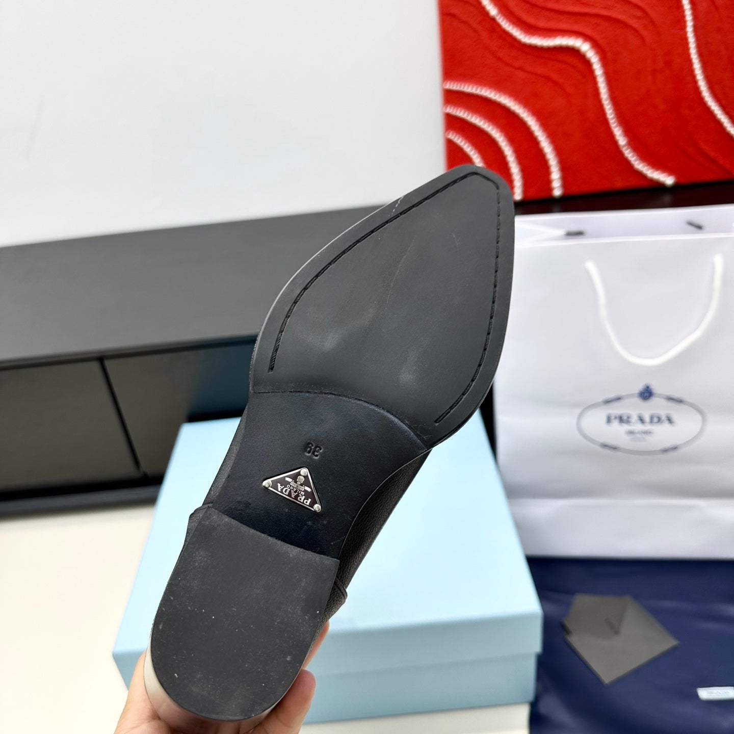 PRADA 25S POINTED-TOE LOW-CUT BOOTS IN BLACK COWHIDE