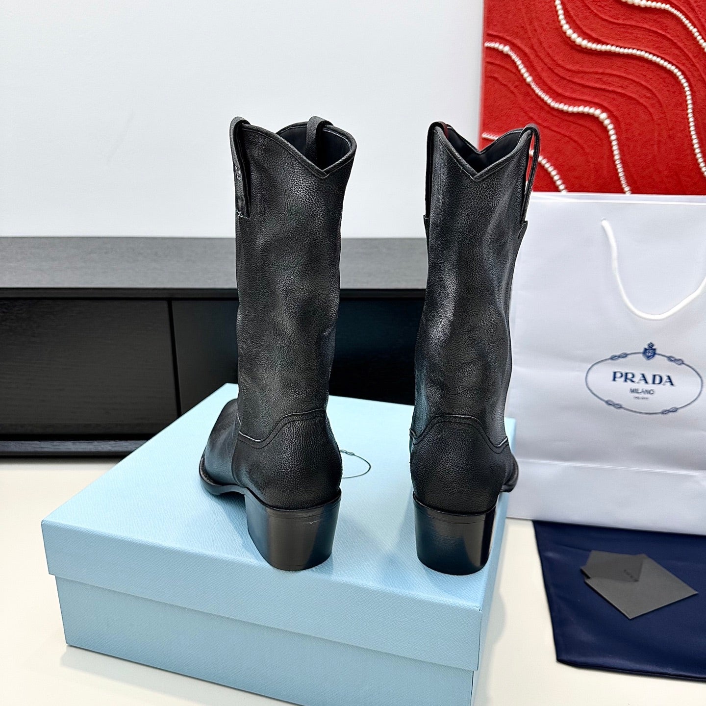 PRADA 25S POINTED-TOE LOW-CUT BOOTS IN BLACK COWHIDE