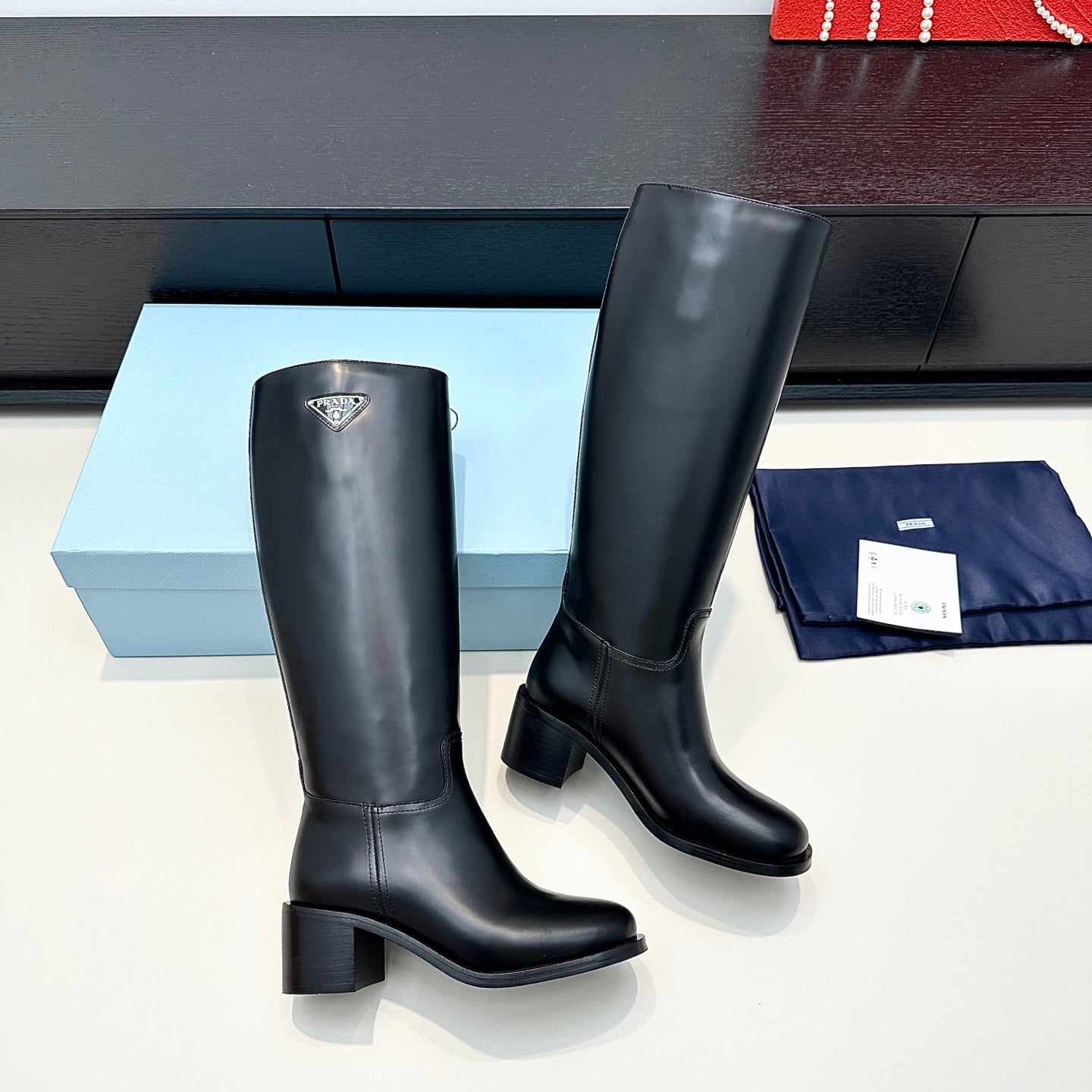 PRADA 25S HIGH-CUT BOOTS 55 MM IN BLACK CALFSKIN