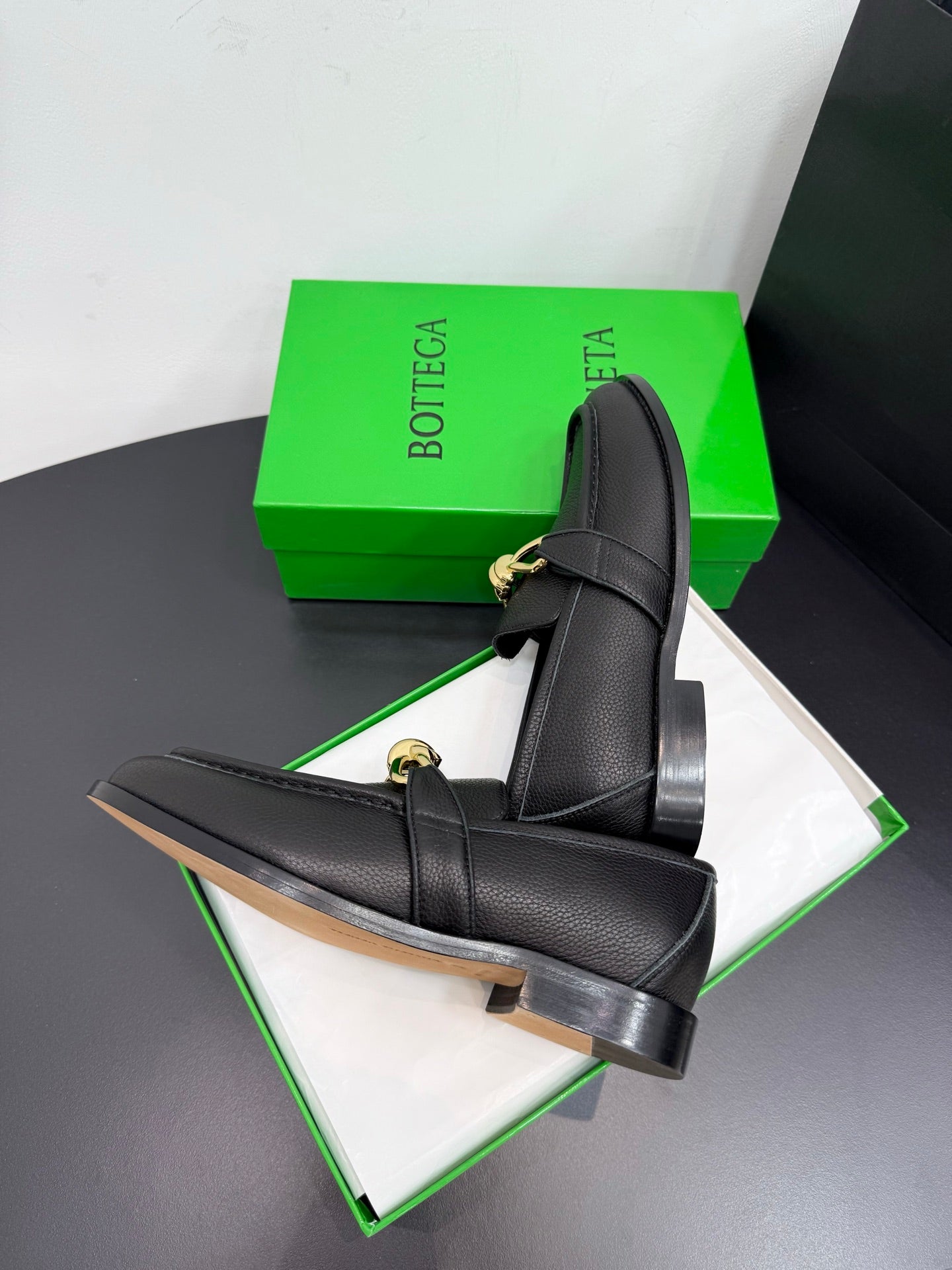 BOTTEGA VENETA 26S LOAFERS IN BLACK GRAINED CALFSKIN WITH GOLD HARDWARE