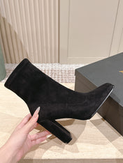 ALAIA 26S HEELED BOOTS 90 MM IN BLACK SUEDE