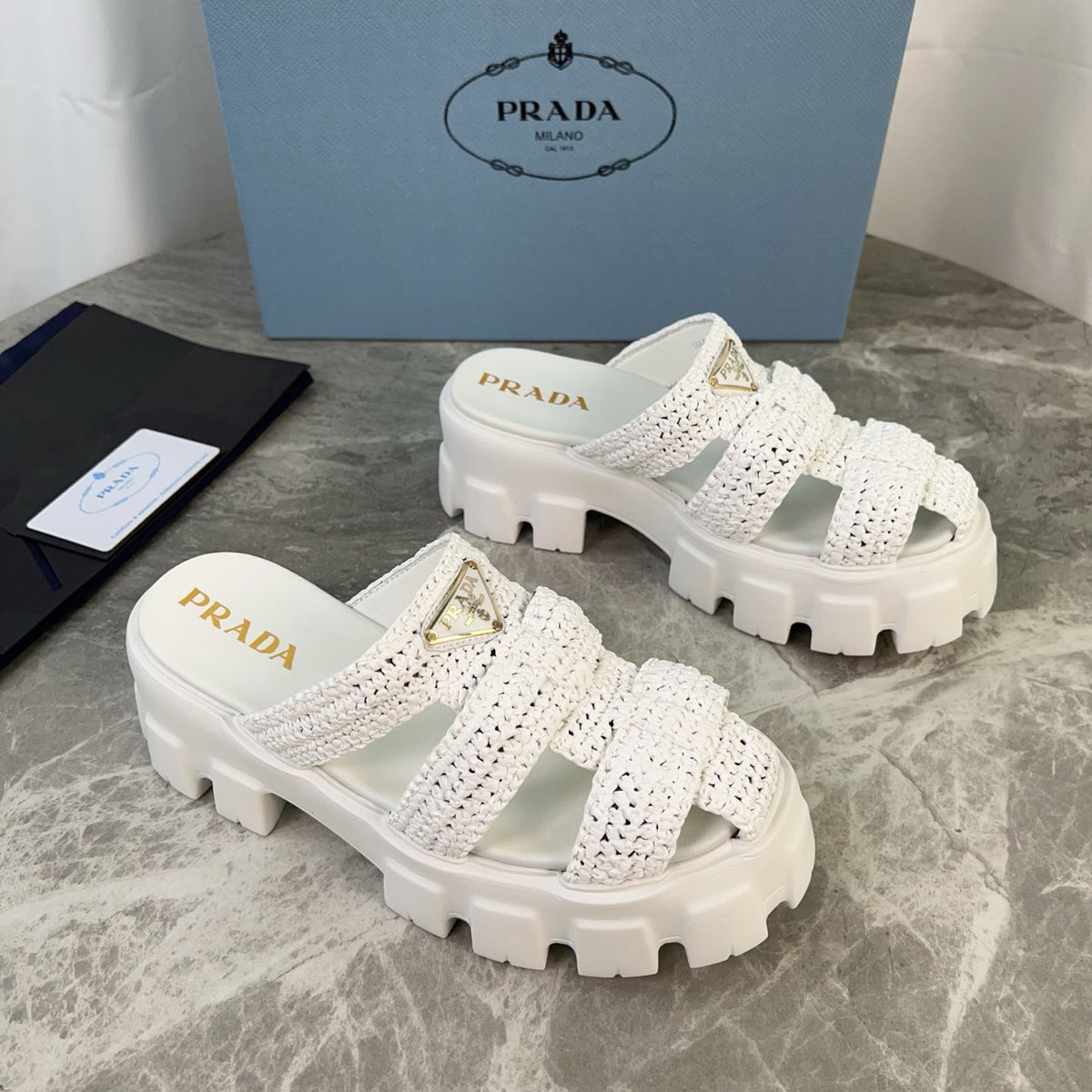 PRADA 25S MONOLITH RUBBER MULES IN WHITE RAFFIA AND LAMBSKIN