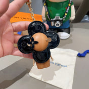 LV KEYCHAIN IN BLACK CALFSKIN AND WOOD