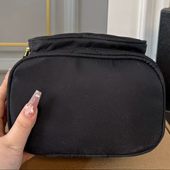 DRAWSTRING BUCKET BAG 23 IN BLACK QUILTED RE-NYLON