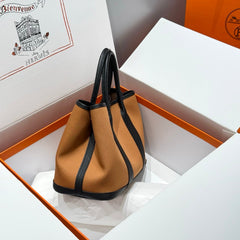 GARDEN PARTY 30CM IN ORANGE MINIMUM TOILETS COTTON CANVAS AND BLACK CALFSKIN