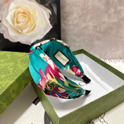 HAIRBAND IN TURQUOISE GREEN FLORAL SILK 252676