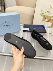 PRADA 26S MARY JANE FLATS IN BLACK WOVEN RAFFIA WITH TRIANGLE LOGO