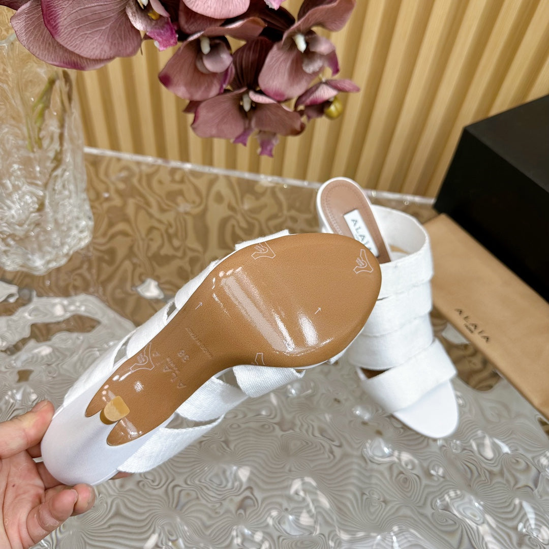 ALAIA ELASTIC CAGE MULE SANDALS IN WHITE WOVEN STRAP AND LAMBSKIN