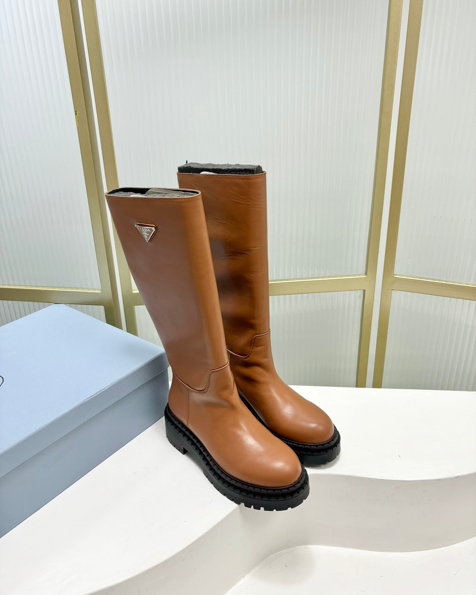 KNEE BOOTS WITH TRIANGLE LOGO IN CAMEL CALFSKIN