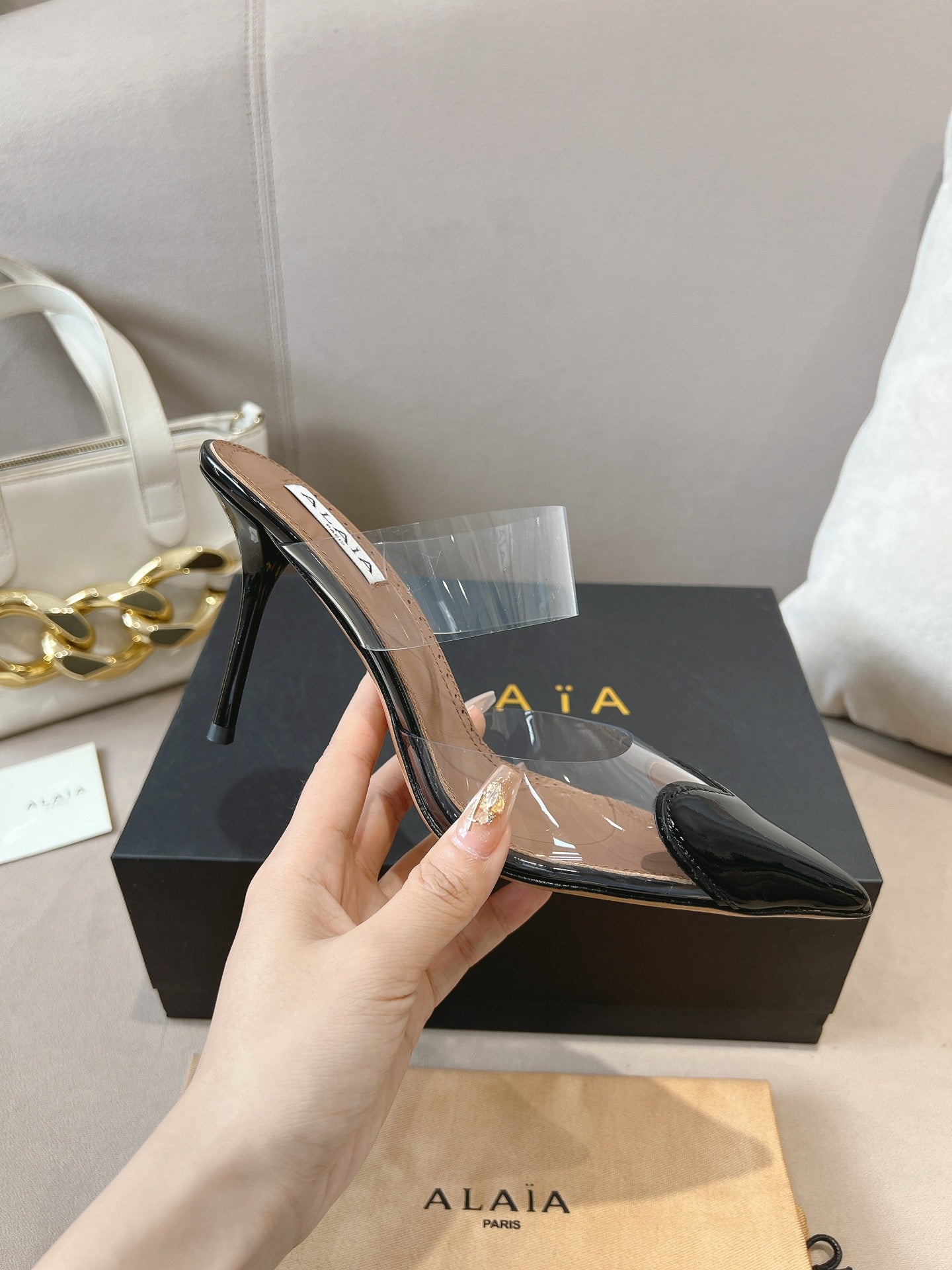 ALAIA HIGH MULES IN BLACK PATENT CALFSKIN AND FILM