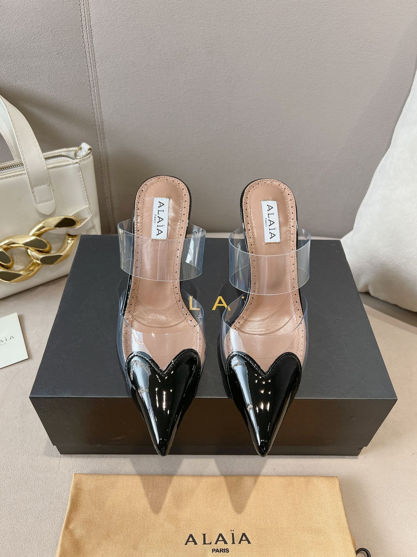 ALAIA HIGH MULES IN BLACK PATENT CALFSKIN AND FILM