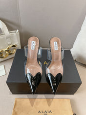 ALAIA HIGH MULES IN BLACK PATENT CALFSKIN AND FILM