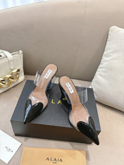 ALAIA 26S HIGH-HEEL WEDGE MULES 95 MM IN BLACK GLOSSY CALFSKIN