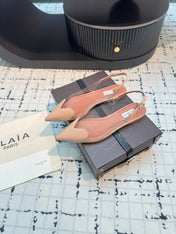 ALAIA FLAT SLINGBACK IN BEIGE BISQUE PATENT CALFSKIN AND FILM